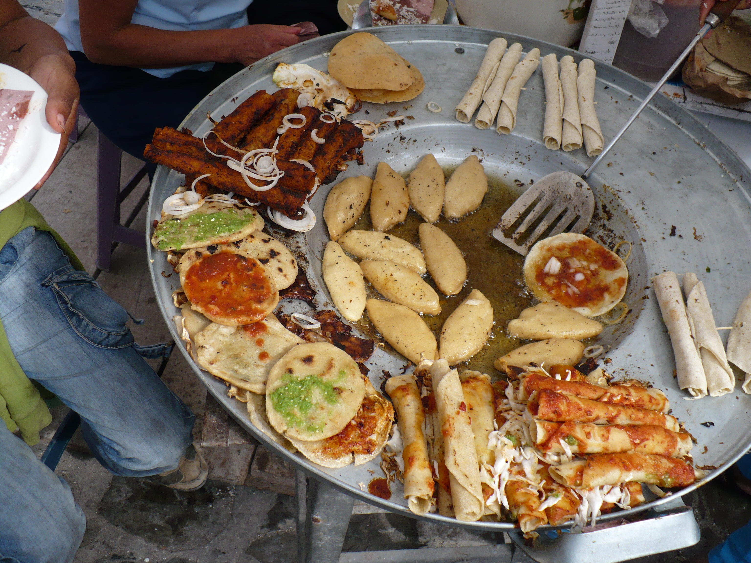Fried tacos and enchiladas with salsa in Cuetzalan.