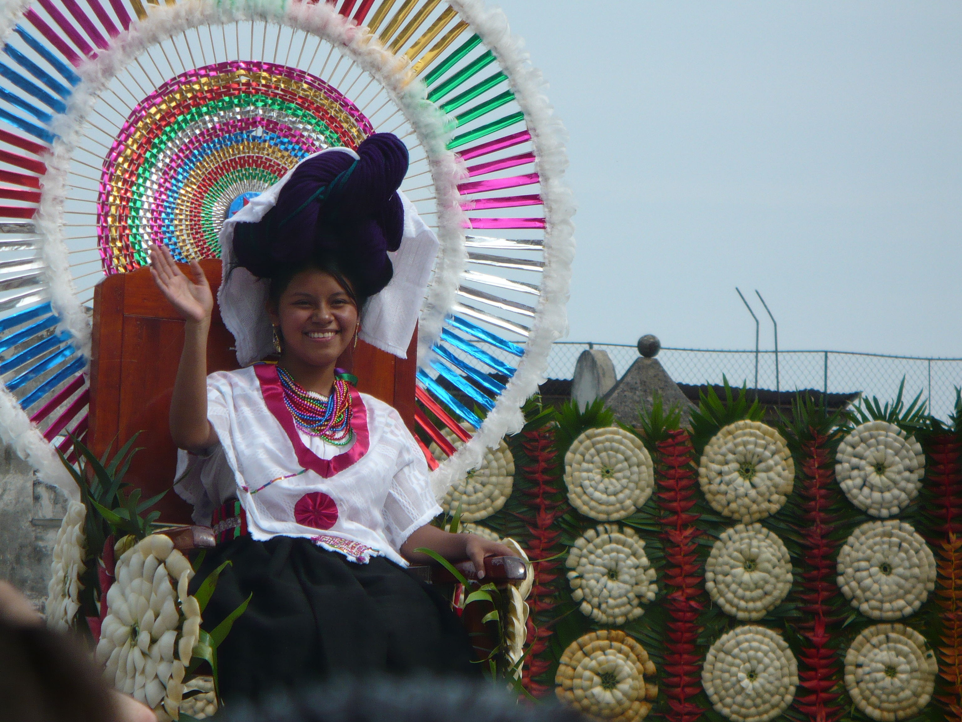 The queen of the feria waves to the crowd in Cuetzalan.